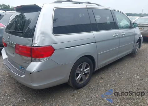 2010 Honda Odyssey Touring z USA, uszkodzony, nr VIN 5FNRL3H9XAB085936